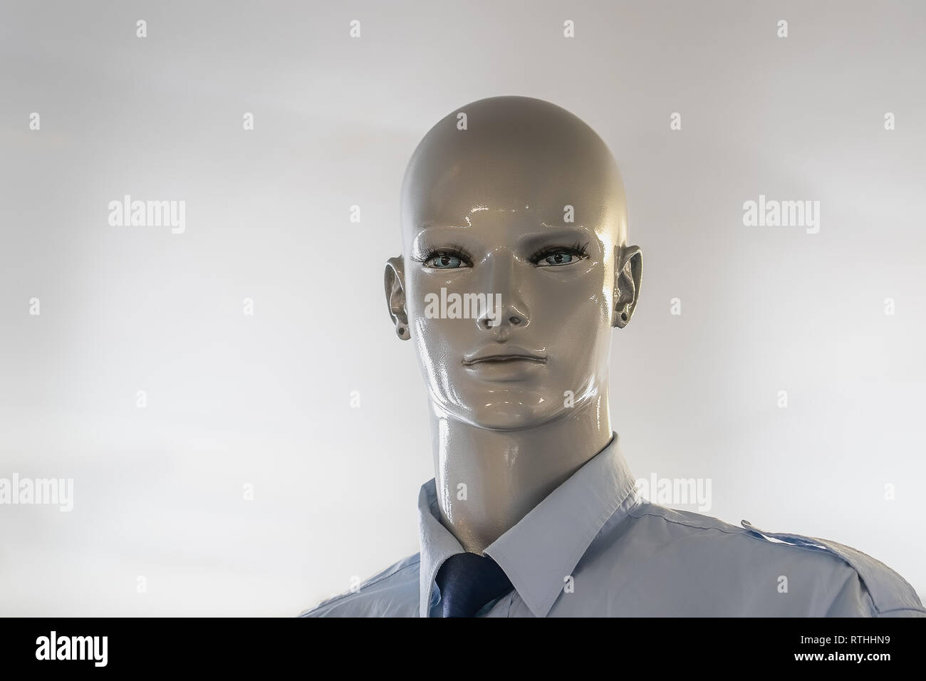 Head of a bald mannequin with a shirt on. The mannequin also wears a docking tie Stock Photo