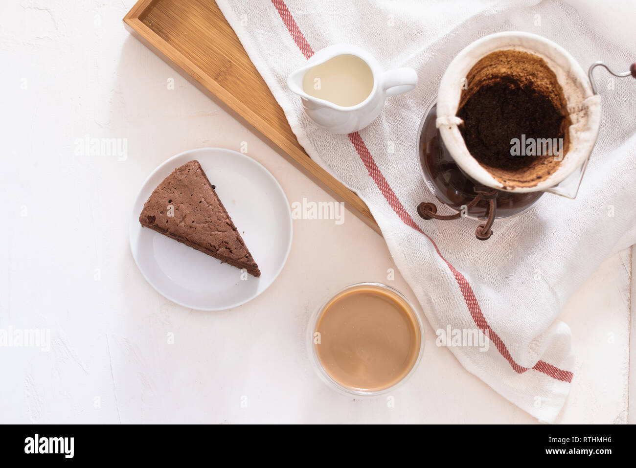 Breakfast with chocolate cake and coffee served on a beautiful living