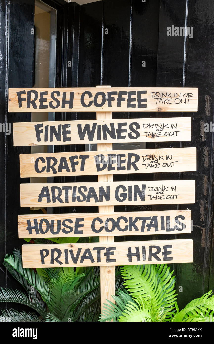 Wine bar or restaurant drink in or take out sign on display Stock Photo