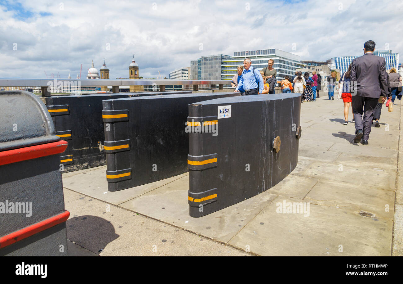 Anti-vehicle barriers erected on the pavement on London Bridge in the Borough area, Southwark London SE1 as a terrorism prevention measure Stock Photo