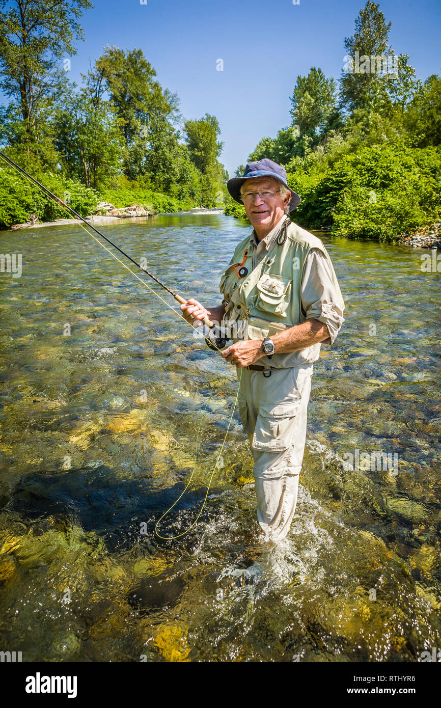 A 70 year old man fly fishing in the Cedar River, Western Washington, USA  Stock Photo - Alamy