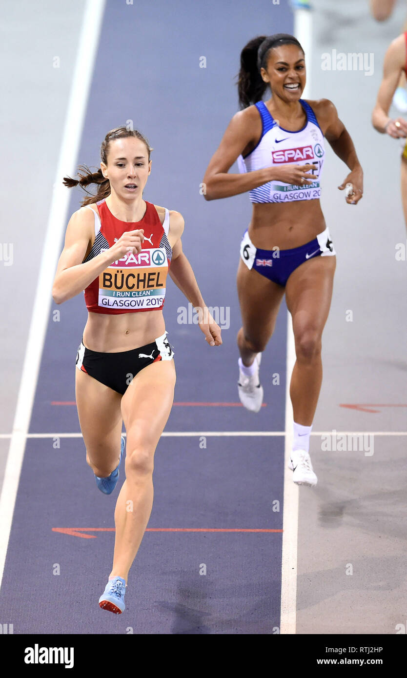 Switzerland's Selina Buchel comes over the line ahead of Great Britain's Adelle Tracey at the finish of the Women's 800m heat 1 during day one of the European Indoor Athletics Championships at the Emirates Arena, Glasgow. Stock Photo