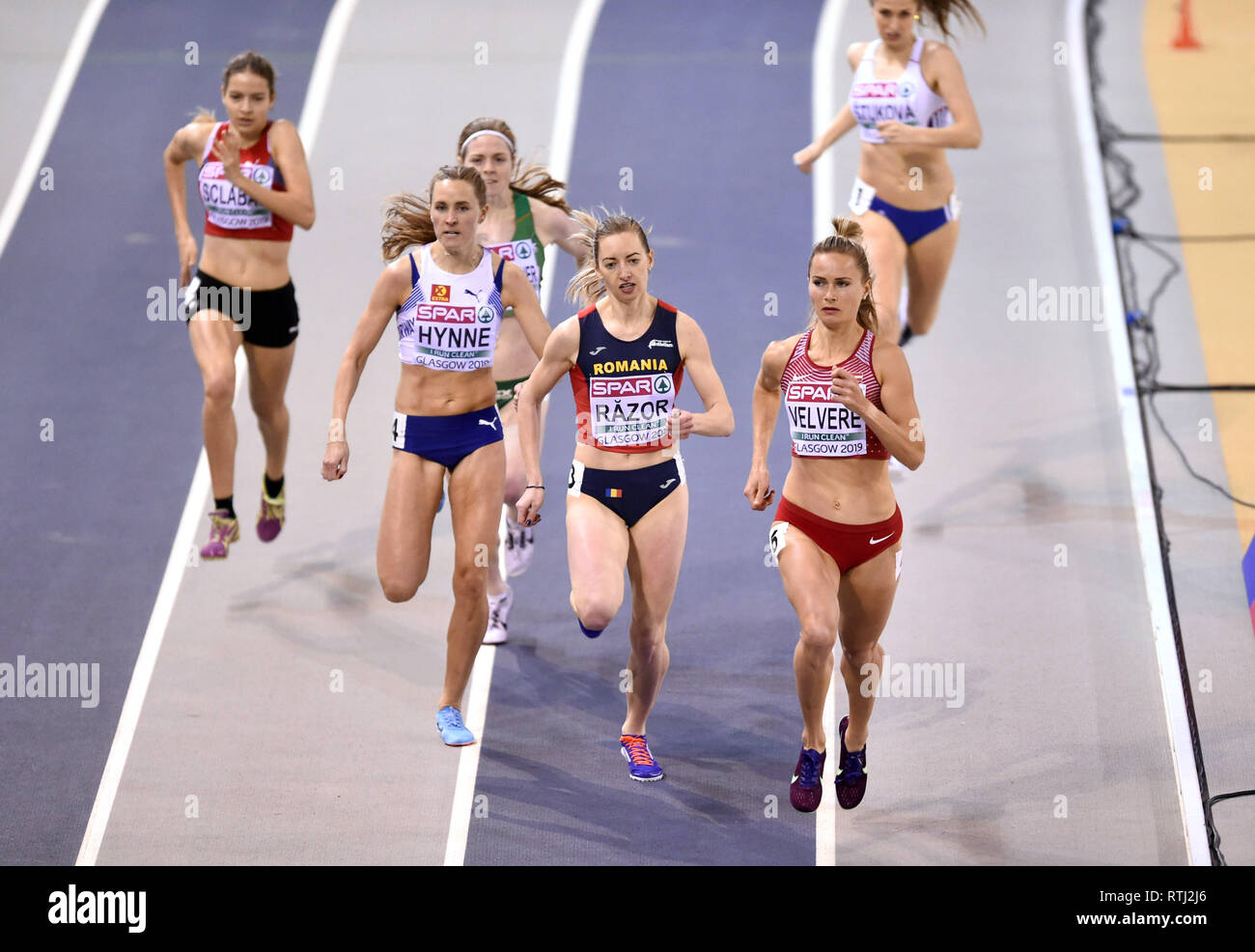 Latvia's Liga Velvere in front with Romania's Bianca Razor and Norway's Hedda Hynne behind competing in the Women's 800m heat 3 during day one of the European Indoor Athletics Championships at the Emirates Arena, Glasgow. Stock Photo