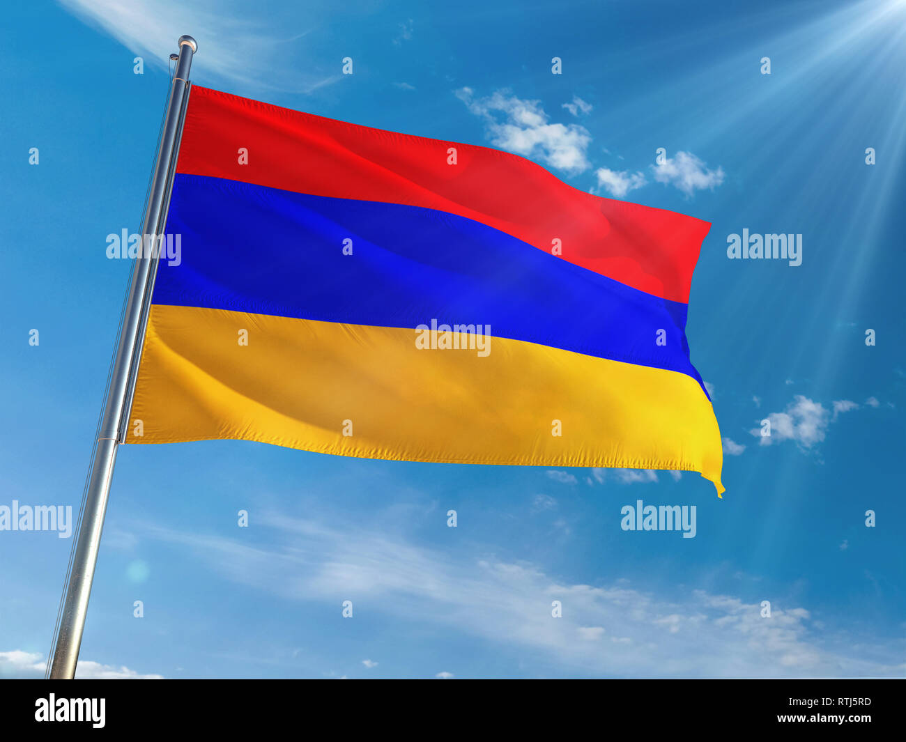 Armenia National Flag Waving on pole against sunny blue sky background ...