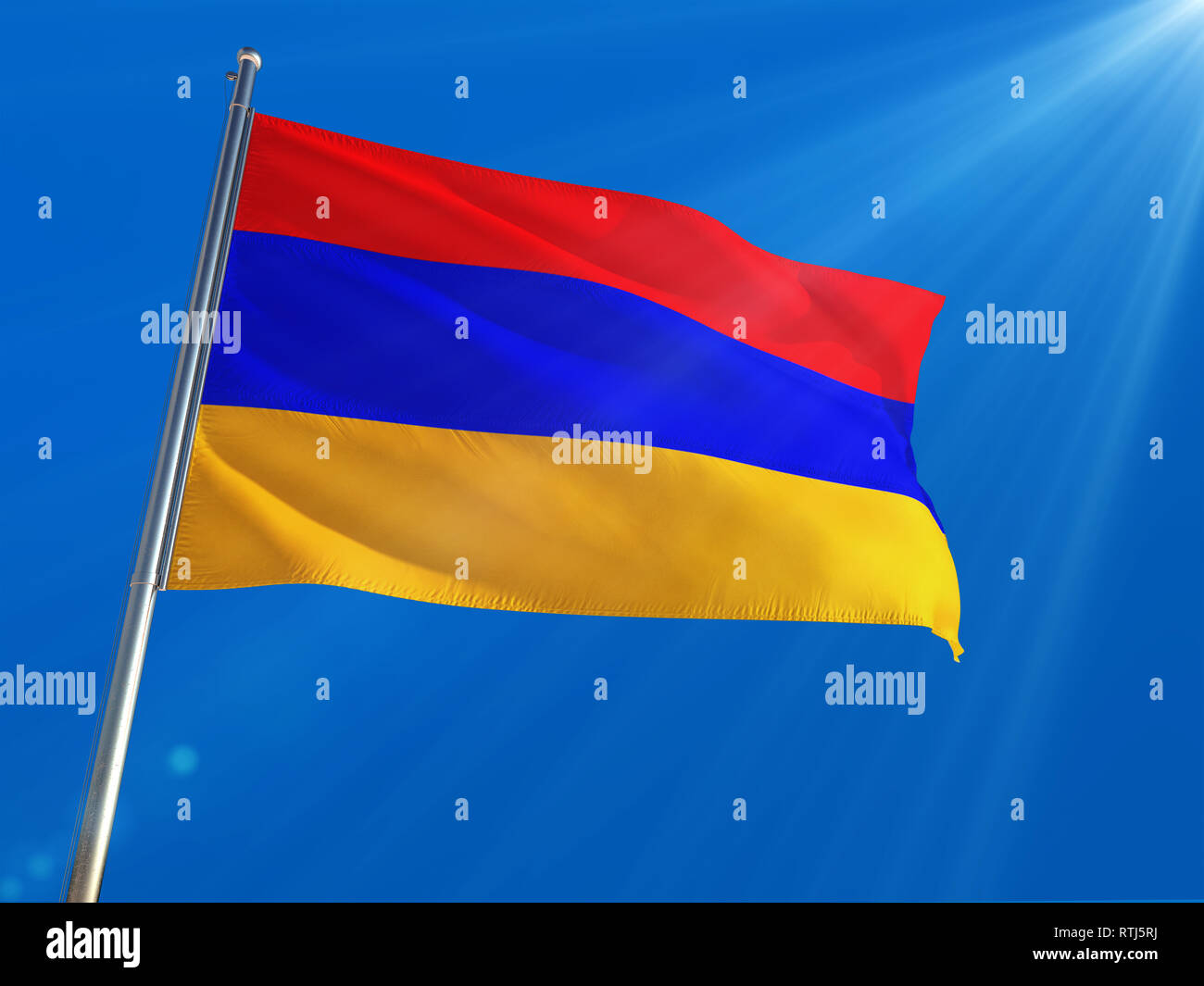 Armenia National Flag Waving on pole against deep blue sky background ...