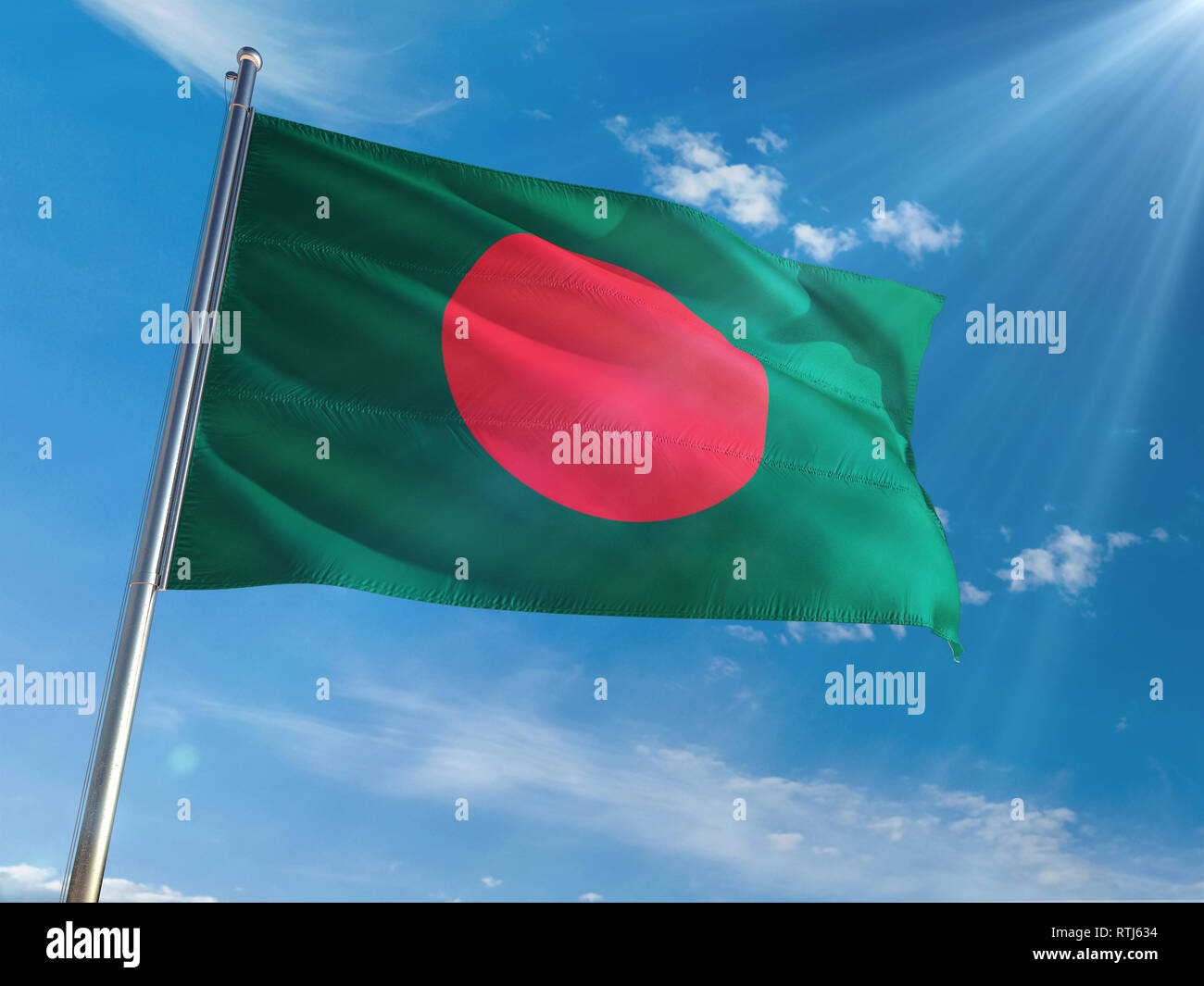 Bangladesh National Flag Waving on pole against sunny blue sky