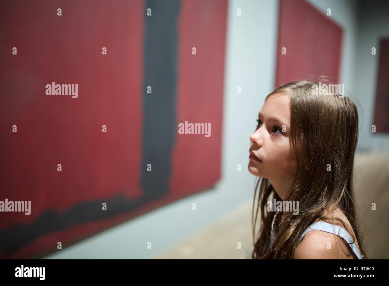 Young girl looking at abstract art Tate Modern art gallery London, Mark Rothko Stock Photo