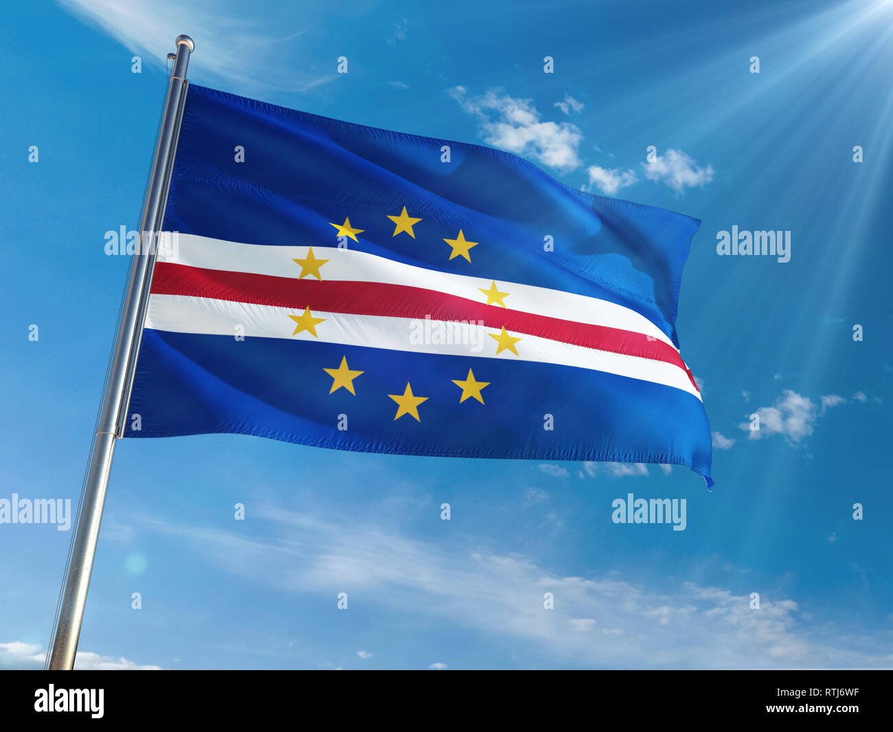 Cape Verde National Flag Waving on pole against sunny blue sky background. High Definition Stock Photo