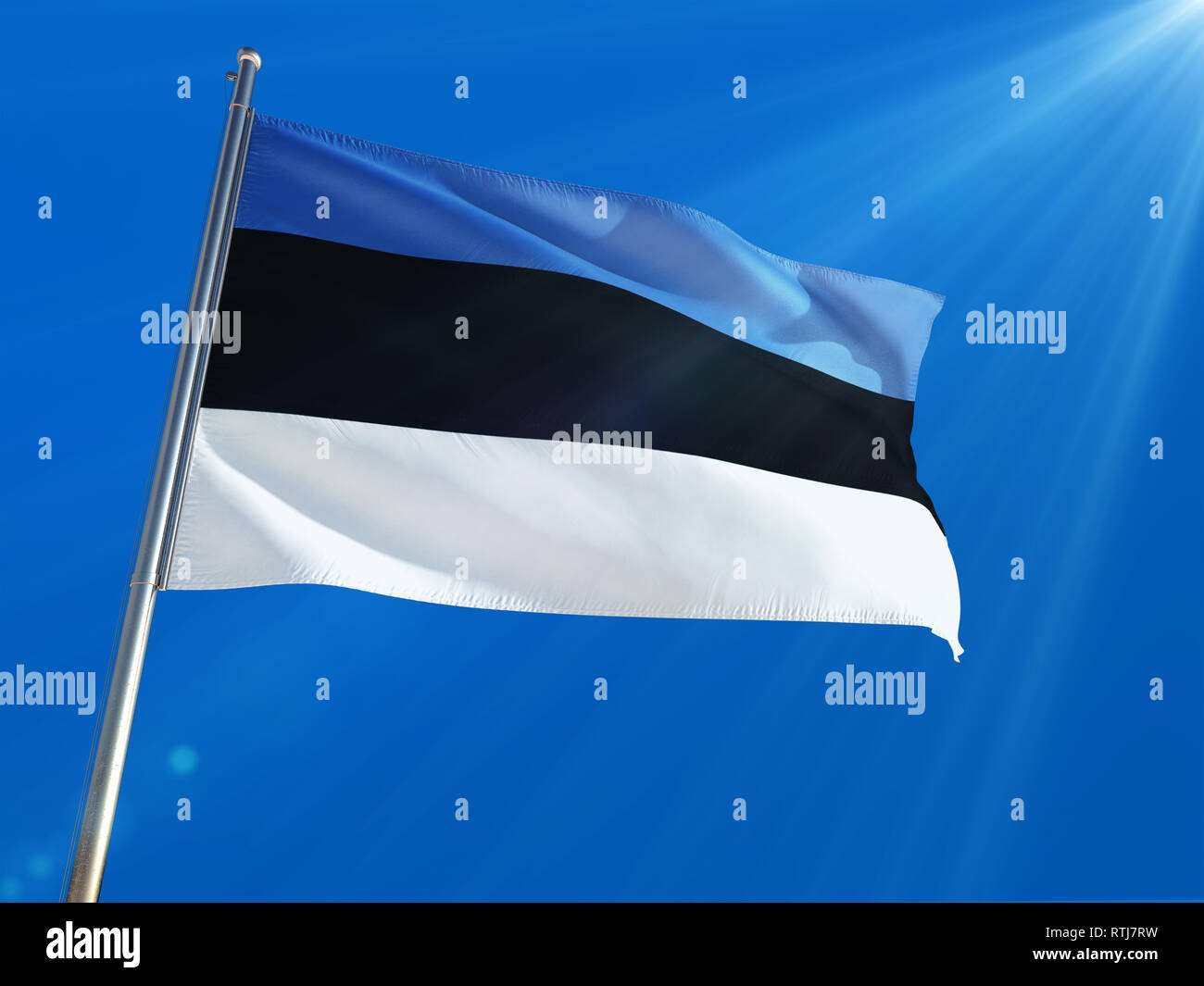 Estonia National Flag Waving on pole against deep blue sky background ...
