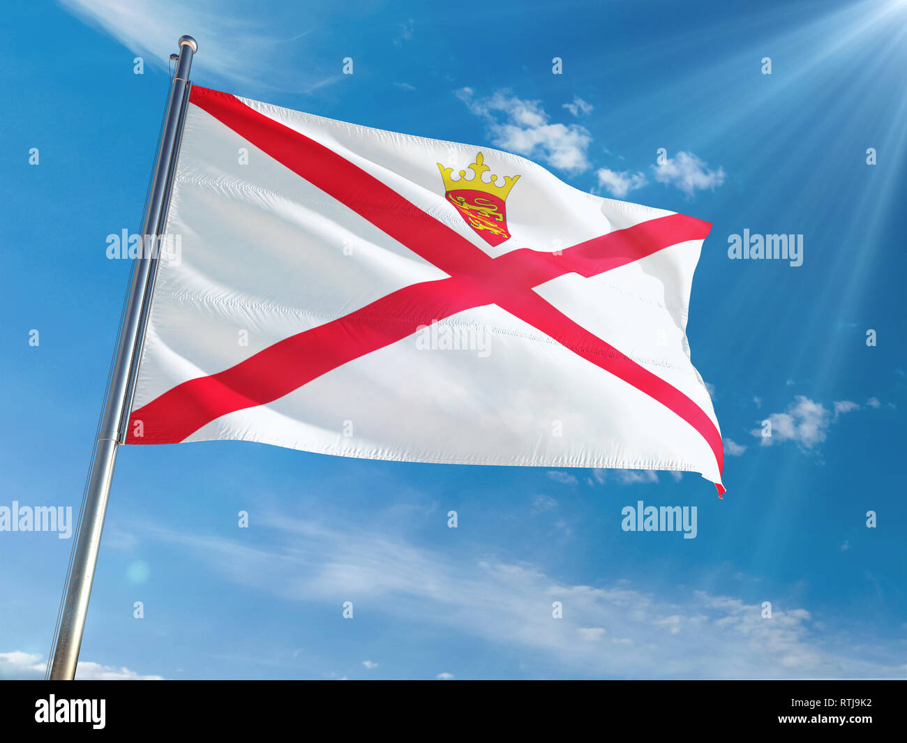 Jersey National Flag Waving on pole against sunny blue sky background