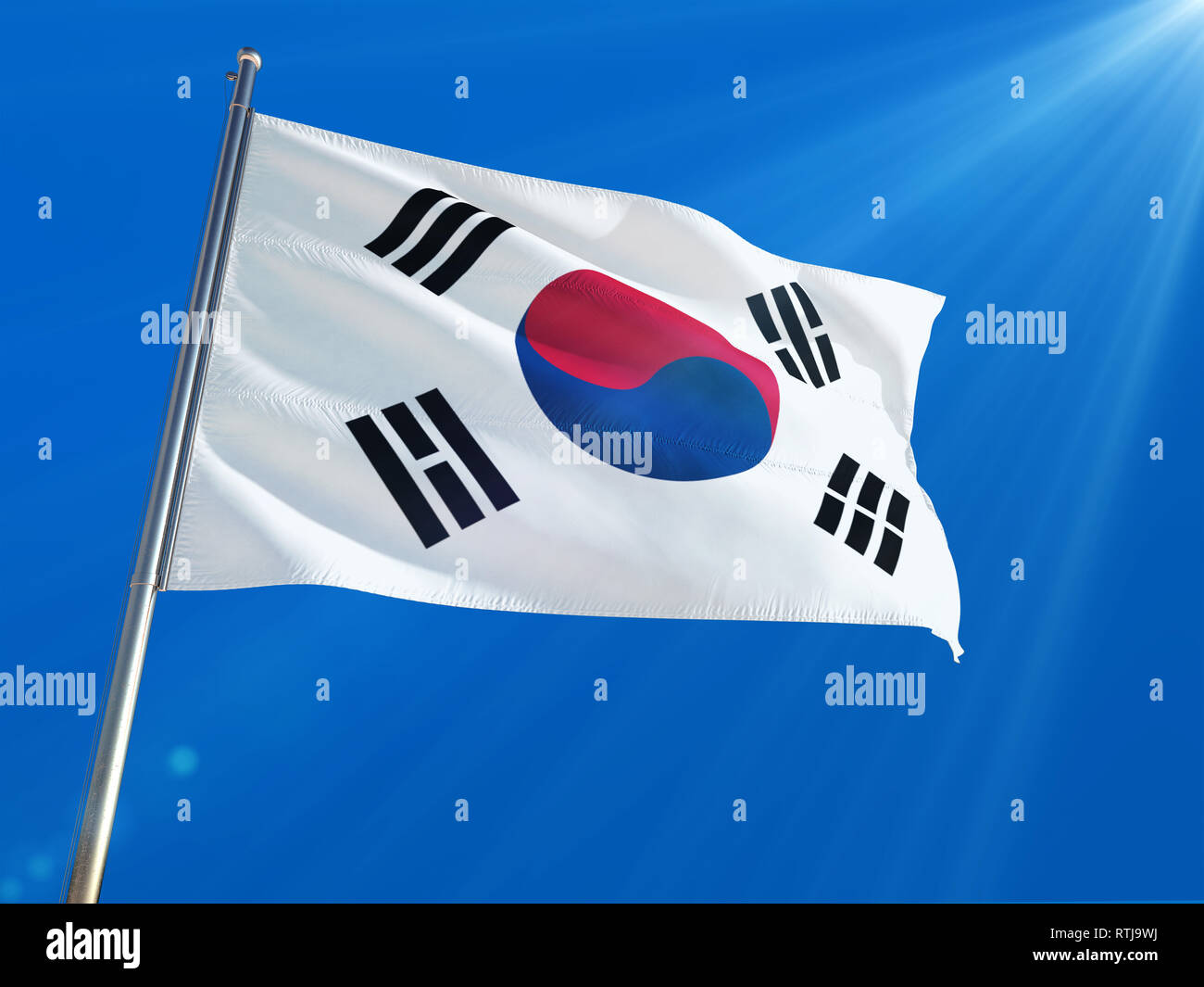 South Korea National Flag Waving On Pole Against Deep Blue Sky
