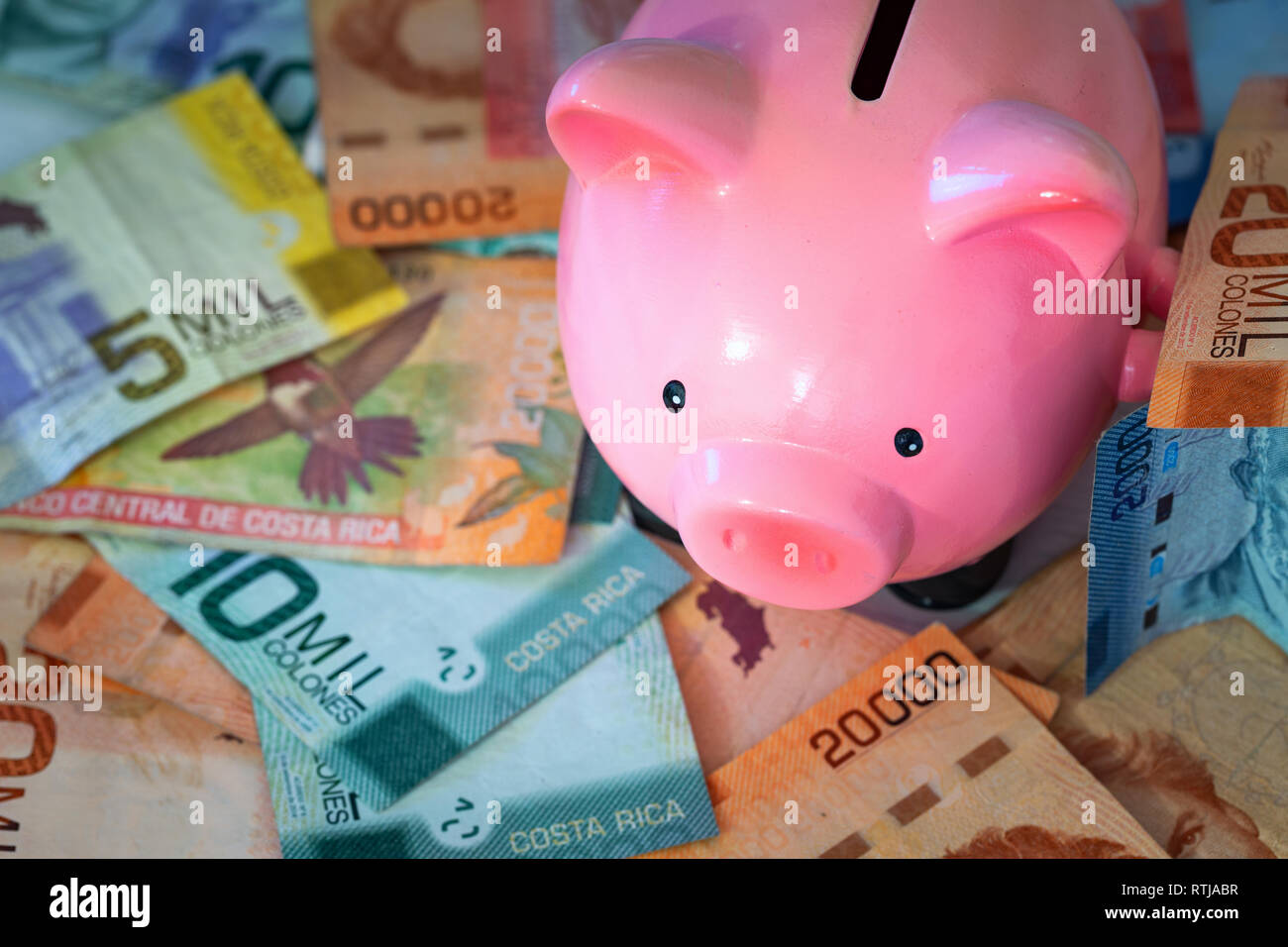 Money from Costa rica / Colones and piggy bank / saving concept Stock Photo