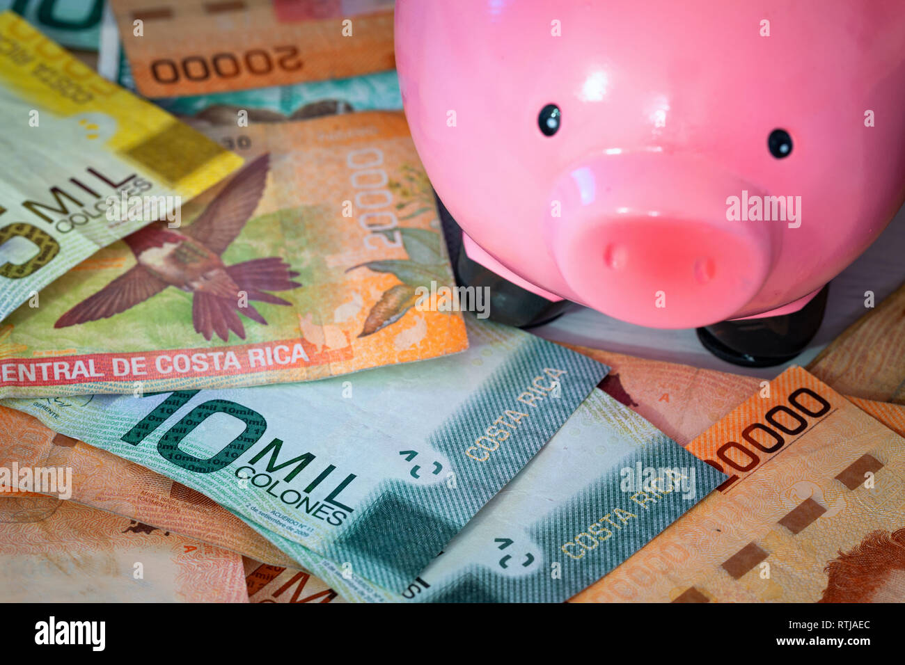 Money from Costa rica / Colones and piggy bank / saving concept Stock Photo