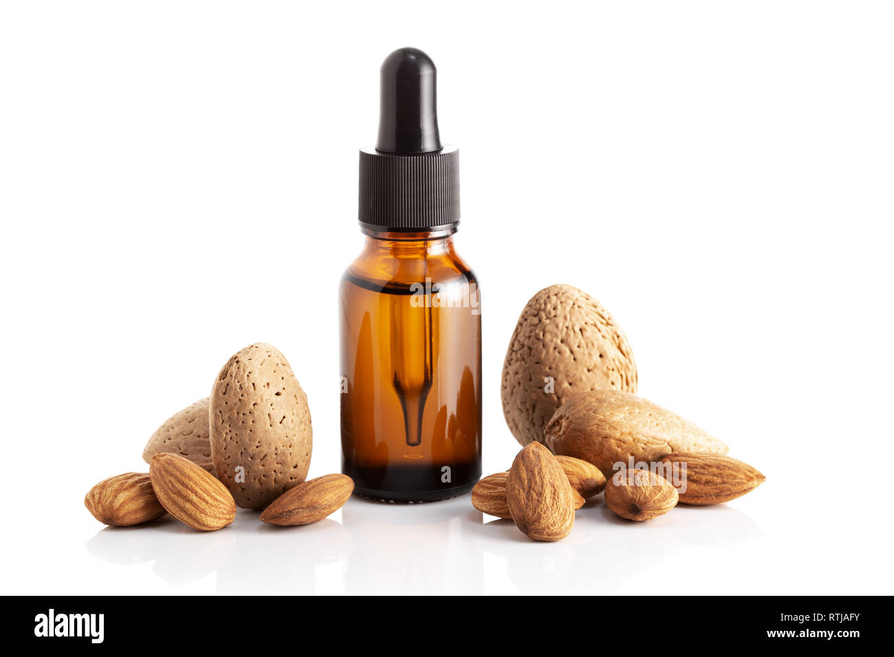 Almond essential oil isolated on white background. Almond oil for Cosmetic or beauty care Stock Photo