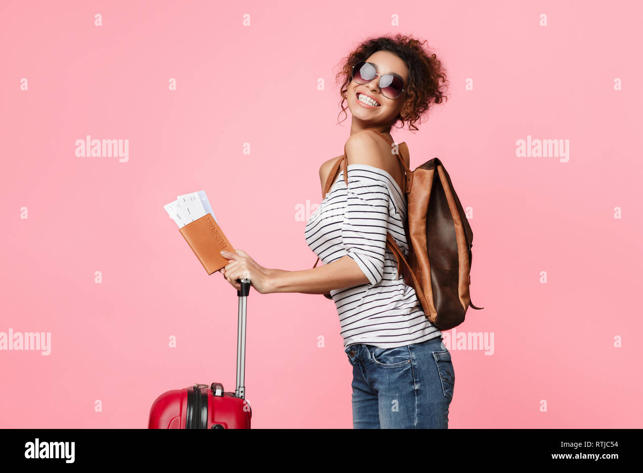 Happy african woman travel bag hi-res stock photography and images - Alamy