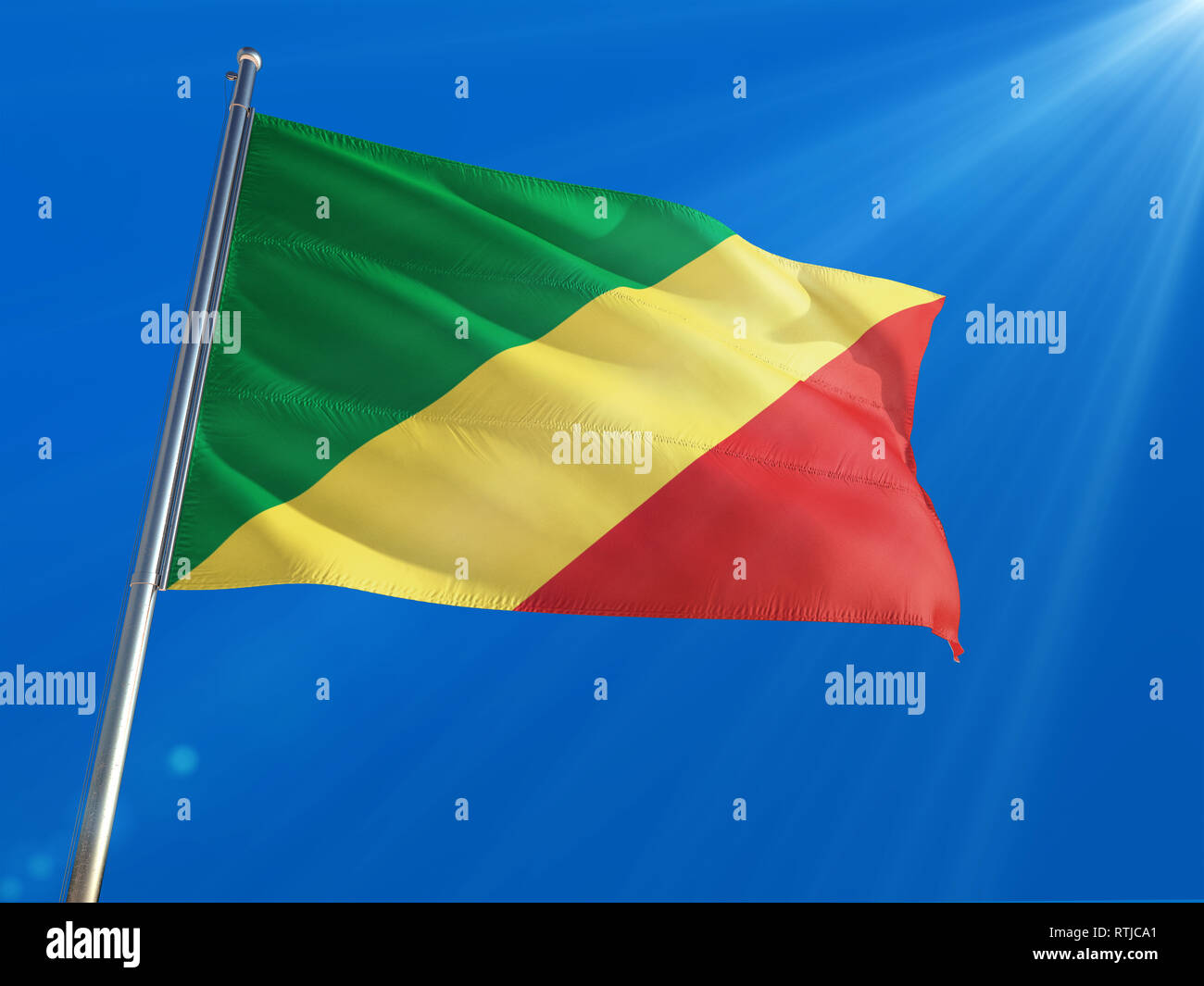Republic Of The Congo National Flag Waving on pole against deep blue ...