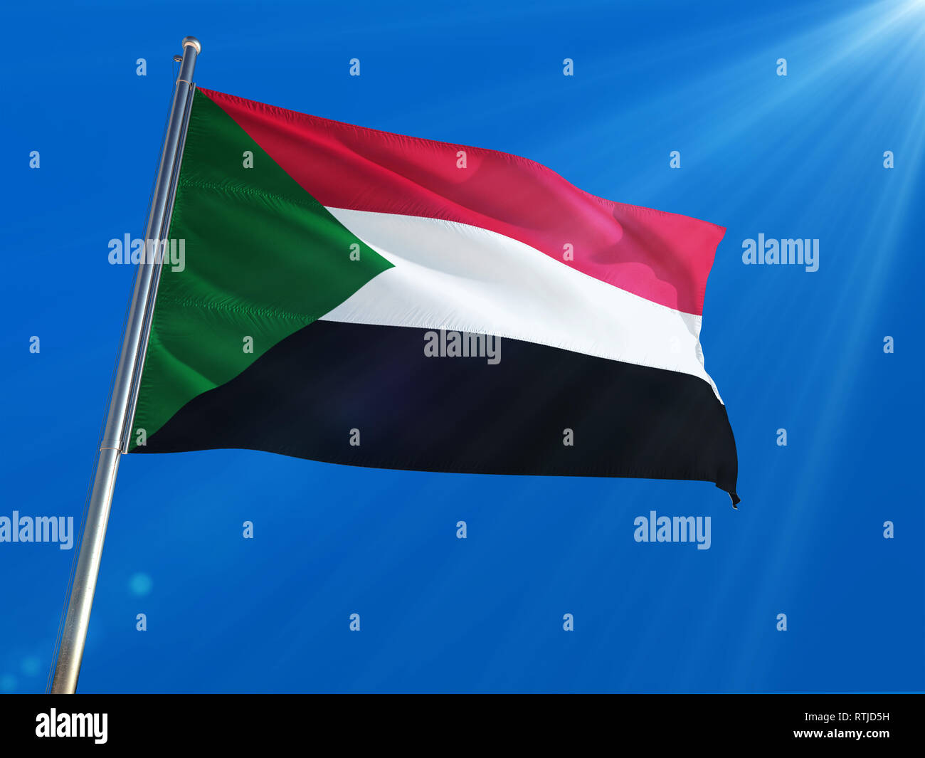 Sudan National Flag Waving On Pole Against Deep Blue Sky