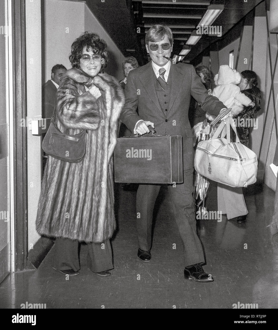 Actress Dame Elizabeth Taylor and husband U.S. attorney John Warner arriving at London's ...