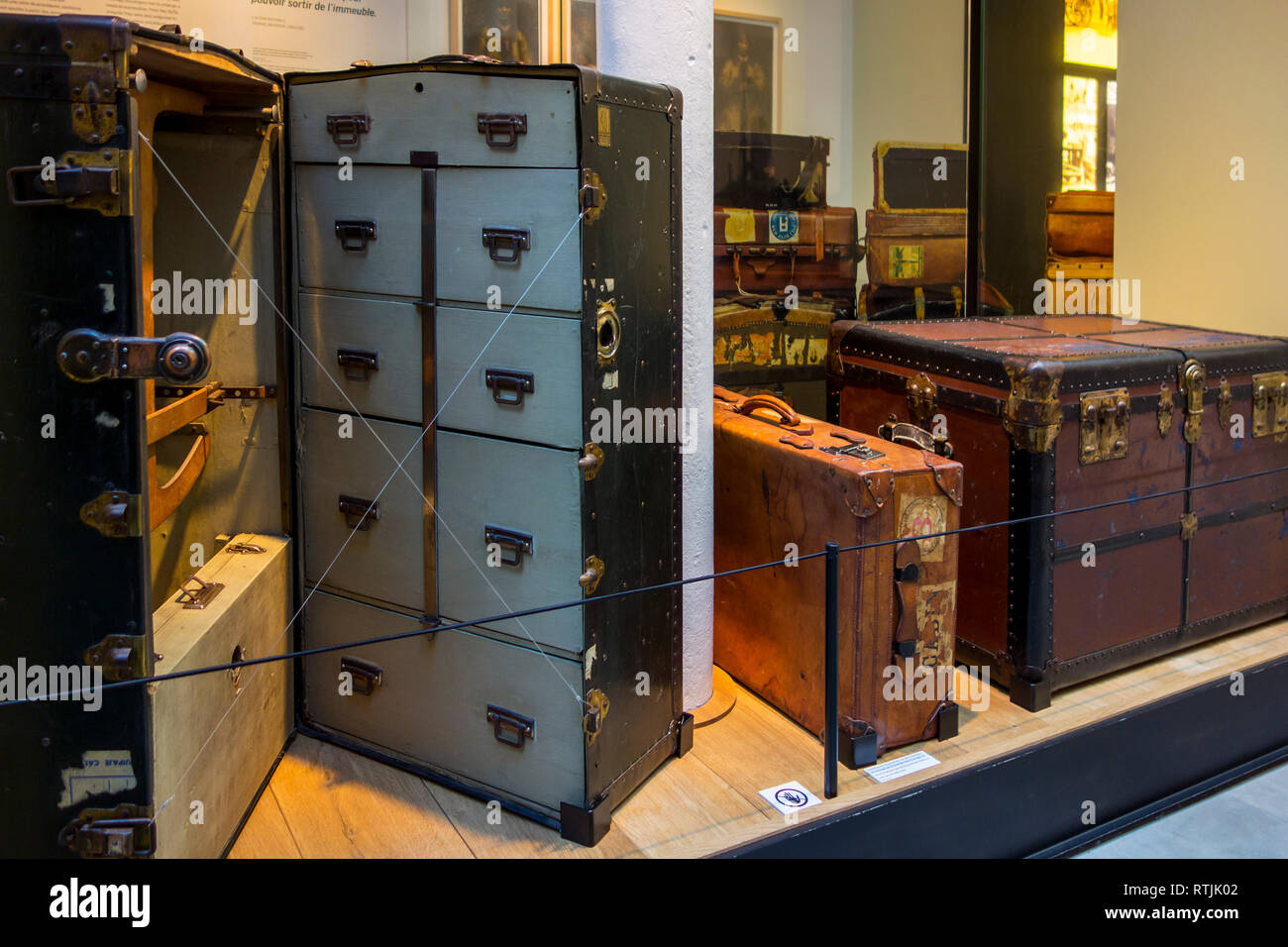 Vintage suitcases and emigrants' travel trunks of the early 1900s in the Red Star Line museum in the port of Antwerp, Flanders, Belgium Stock Photo