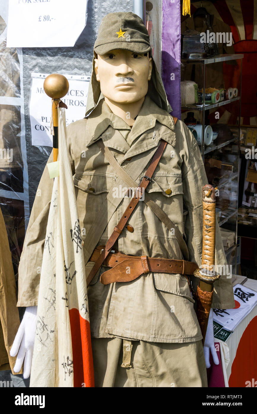 Mannequin in world war two Japanese uniform with samurai sword, outside