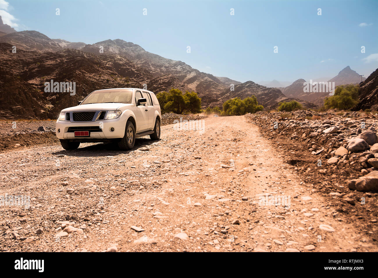 Off-road vehicle on the Jebel Shams mountains (Oman) Stock Photo