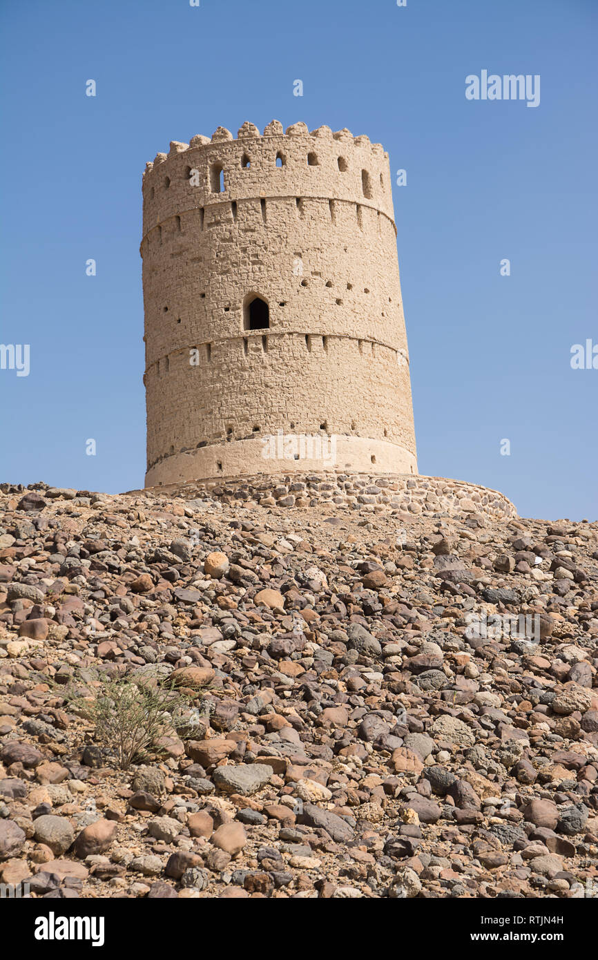 Ancient tower on top of a rocky hill in Oman Stock Photo