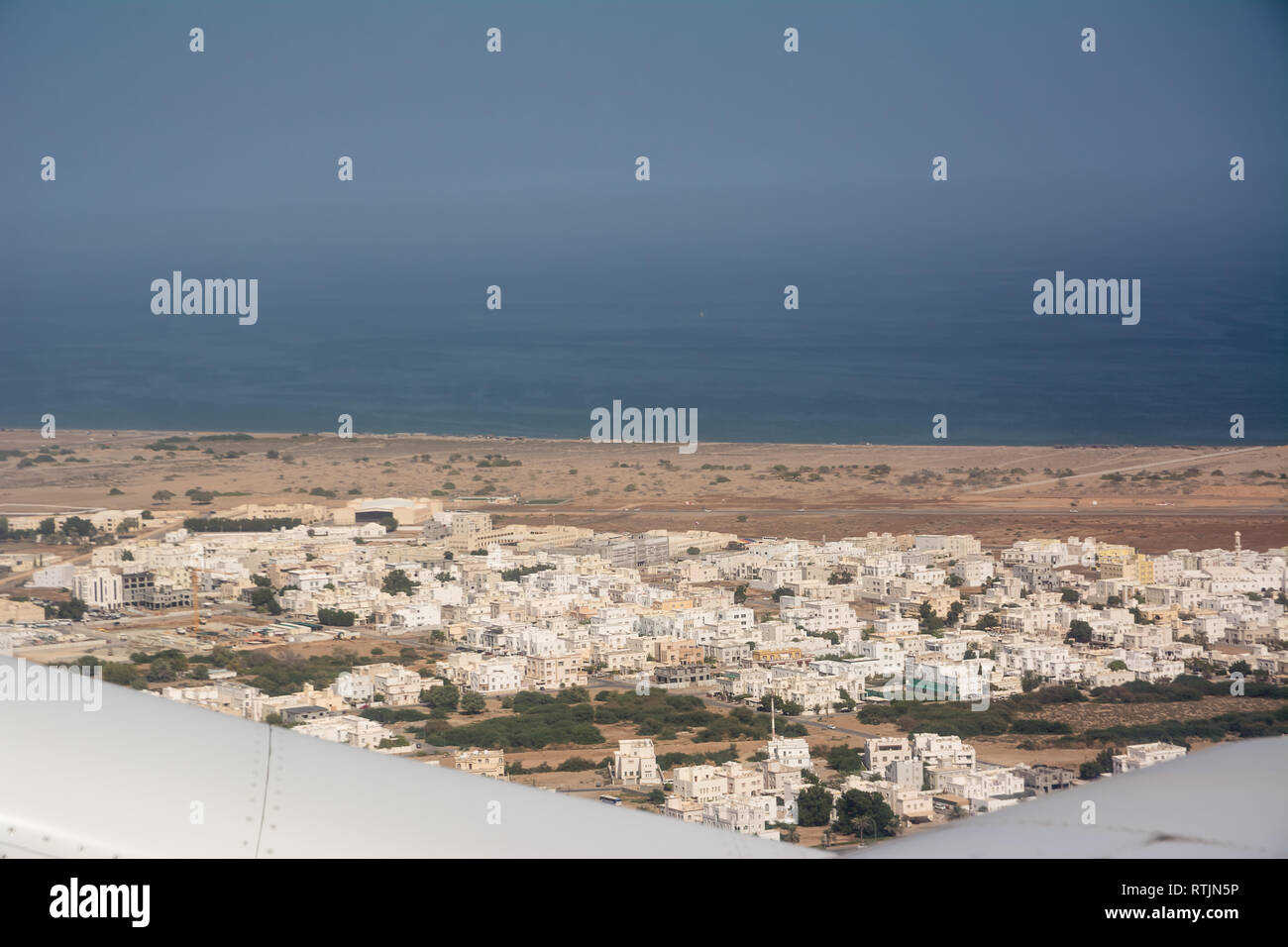 View from the plane of the city of Seeb, near Muscat (Oman) Stock Photo