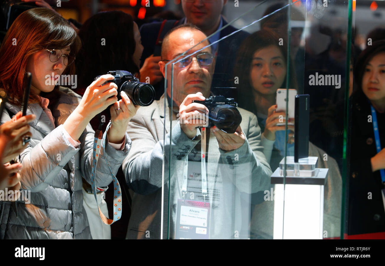 Visitrs take pictures of the new Huawei Mate X foldable mobile shown in mobile world congress in Barcelona. Stock Photo