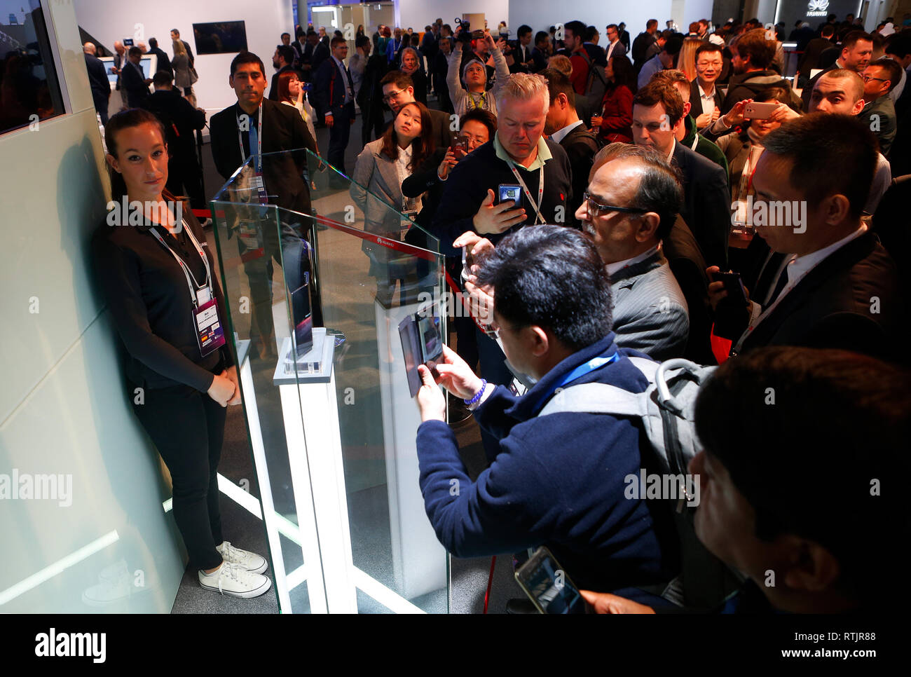 Visitrs take pictures of the new Huawei Mate X foldable mobile shown in mobile world congress in Barcelona. Stock Photo