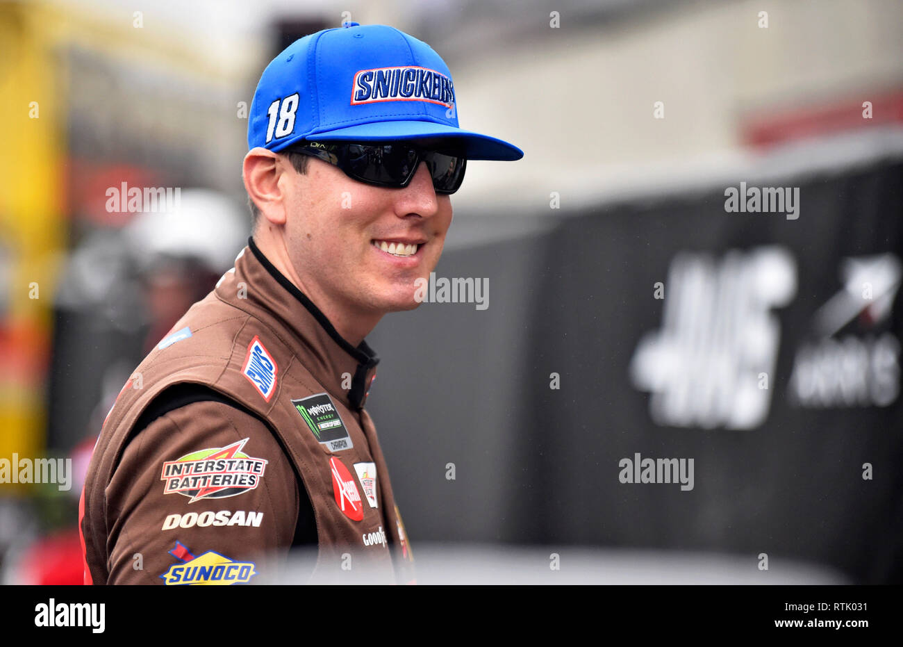 Hampton, GA, USA. 23rd Feb, 2018. Kyle Busch walks through the garage