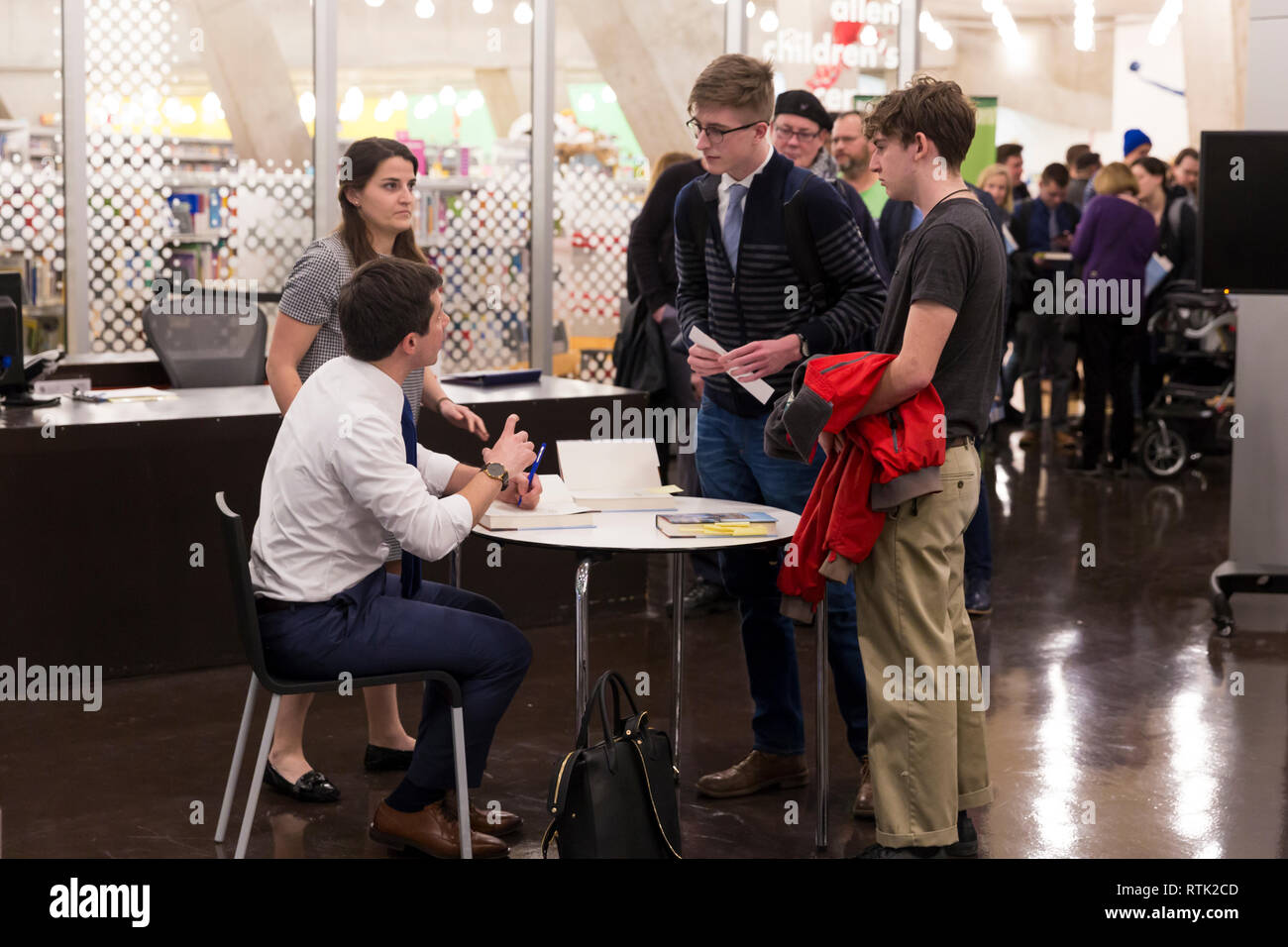 Seattle, Washington DC, USA. 28th Feb 2019. South Bend Indiana Mayor and 2020 presidential candidate Pete Buttigieg signs copies of his biography 'Shortest Way Home' at the Seattle Central Library. Credit: Paul Christian Gordon/Alamy Live News Stock Photo