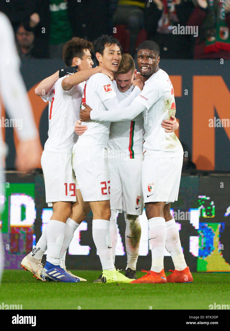 Augsburg, Germany. 01st Mar, 2019. Dong-Won JI, FCA 22 shoot goal for 1-0, celebrates his goal for, happy, laugh, celebration, Kevin DANSO, FCA 38 Andre HAHN, FCA 28 Ja-Cheol KOO, FCA 19 FC AUGSBURG - BORUSSIA DORTMUND 2-1 - DFL REGULATIONS PROHIBIT ANY USE OF PHOTOGRAPHS as IMAGE SEQUENCES and/or QUASI-VIDEO - 1.German Soccer League, Augsburg, March 1, 2019 Season 2018/2019, matchday 24, BVB, Bavaria Credit: Peter Schatz/Alamy Live News Stock Photo