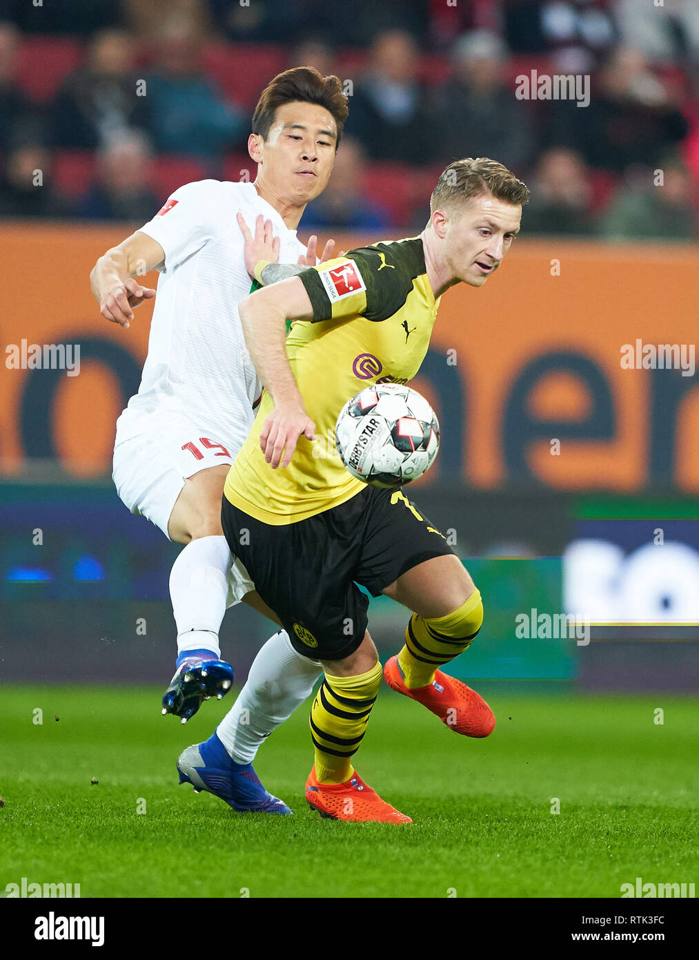 Augsburg, Germany. 01st Mar, 2019. Marco REUS, BVB 11 compete for the ball, tackling, duel, header, action, fight against Ja-Cheol KOO, FCA 19 FC AUGSBURG - BORUSSIA DORTMUND - DFL REGULATIONS PROHIBIT ANY USE OF PHOTOGRAPHS as IMAGE SEQUENCES and/or QUASI-VIDEO - 1.German Soccer League, Augsburg, March 1, 2019 Season 2018/2019, matchday 24, BVB, Bavaria Credit: Peter Schatz/Alamy Live News Stock Photo