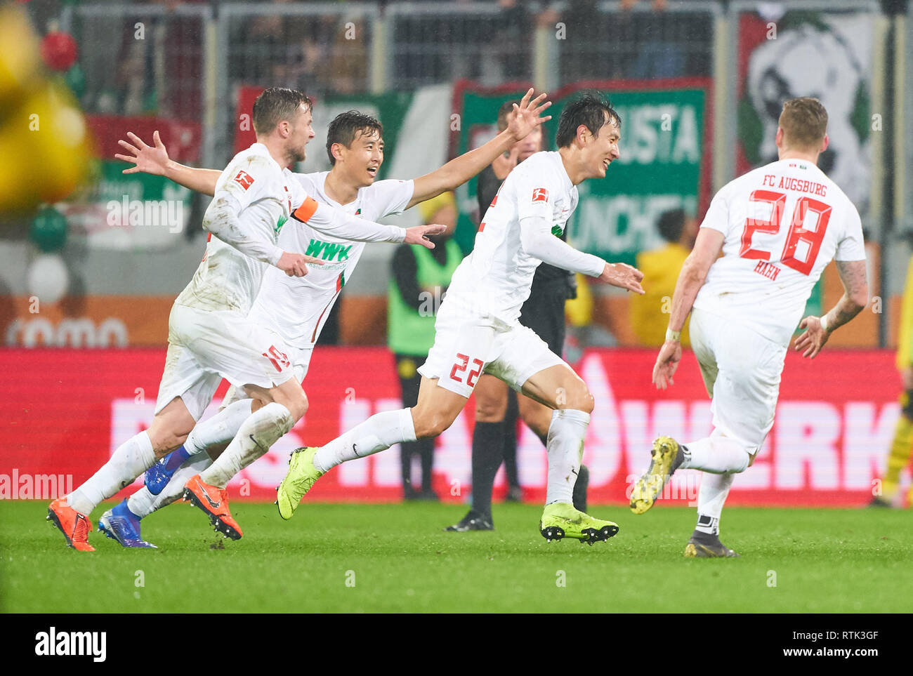 Augsburg, Germany. 01st Mar, 2019. Dong-Won JI, FCA 22 shoot goal for 2-0 celebrates his goal for, happy, laugh, celebration, FC AUGSBURG - BORUSSIA DORTMUND - DFL REGULATIONS PROHIBIT ANY USE OF PHOTOGRAPHS as IMAGE SEQUENCES and/or QUASI-VIDEO - 1.German Soccer League, Augsburg, March 1, 2019 Season 2018/2019, matchday 24, BVB, Bavaria Credit: Peter Schatz/Alamy Live News Stock Photo