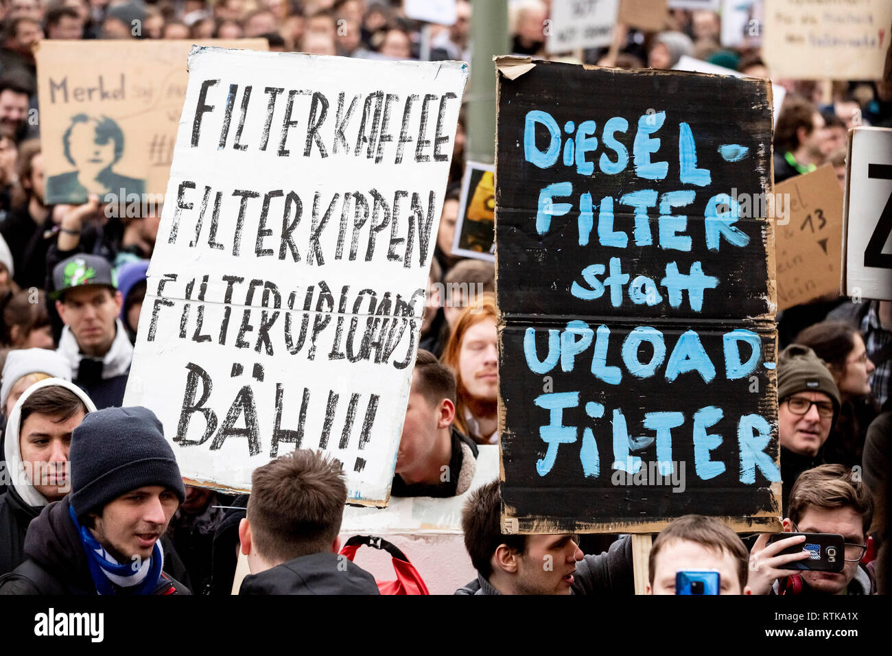 Berlin, Germany. 02nd Mar, 2019. 'Dieselfilter statt Uploadfilter' is written on one of several posters at a demonstration of the alliance 'Berlin gegen 13' against upload filters and EU copyright reform in article 13. Credit: Christoph Soeder/dpa/Alamy Live News Stock Photo
