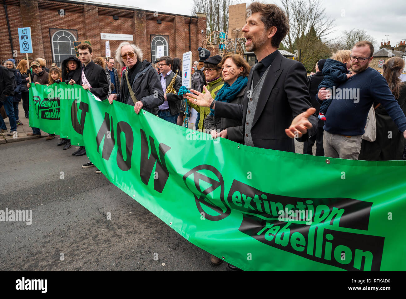Canterbury, UK. 23rd February 2019. Supporters of the Canterbury Extinction Rebellion Group form up in the City Centre then take part in a symbolic funeral procession representing the death of plants, animals, humans and the planet due to the climate crisis, loss or life. The protest will culminated in a swarming action blocking St. Peters Place. Police were present but didn't interfere, there were no arrests. Credit: Stephen Bell/Alamy Live News Credit: Stephen Bell/Alamy Live News Stock Photo