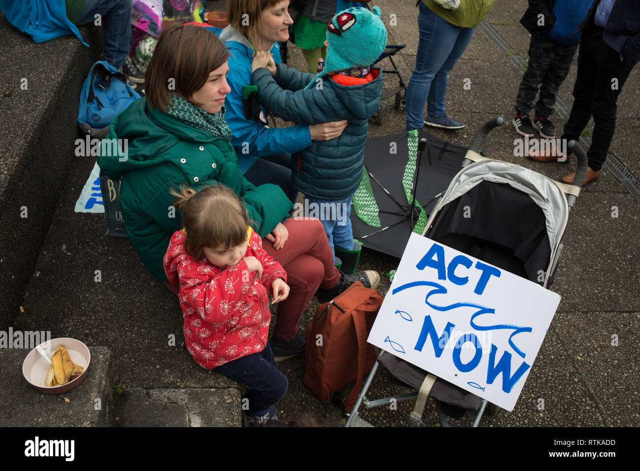 Glasgow, Scotland, 2 March 2019. The 'Blue Wave' demonstration by the Extinction Rebellion climate change group and supporters, blocking roads and moving through the streets of the city to highlight the rising waters of the River Clyde and to warn of the dangers of climate change if urgent action isn't taken immediately. The peaceful demonstration of approximately 200 people culminated with the symbolic throwing of water from the River Clyde on to the City Chambers steps, a symbol of the water levels to come. In Glasgow, Scotland. Credit: Jeremy Sutton-Hibbert/Alamy Live News. Stock Photo