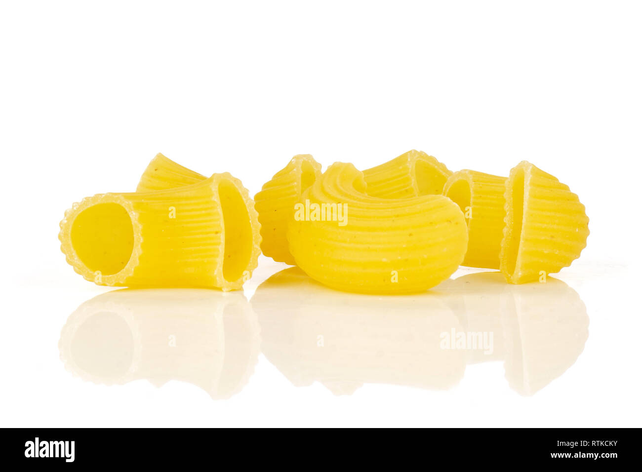 Group of five whole raw pasta pipe rigate variety isolated on white ...