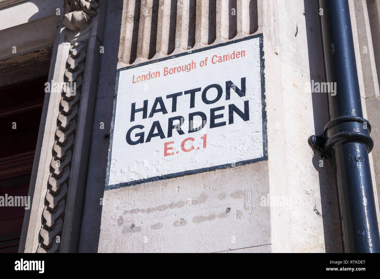 Painted street name sign at Hatton Garden, London Borough of Camden ...