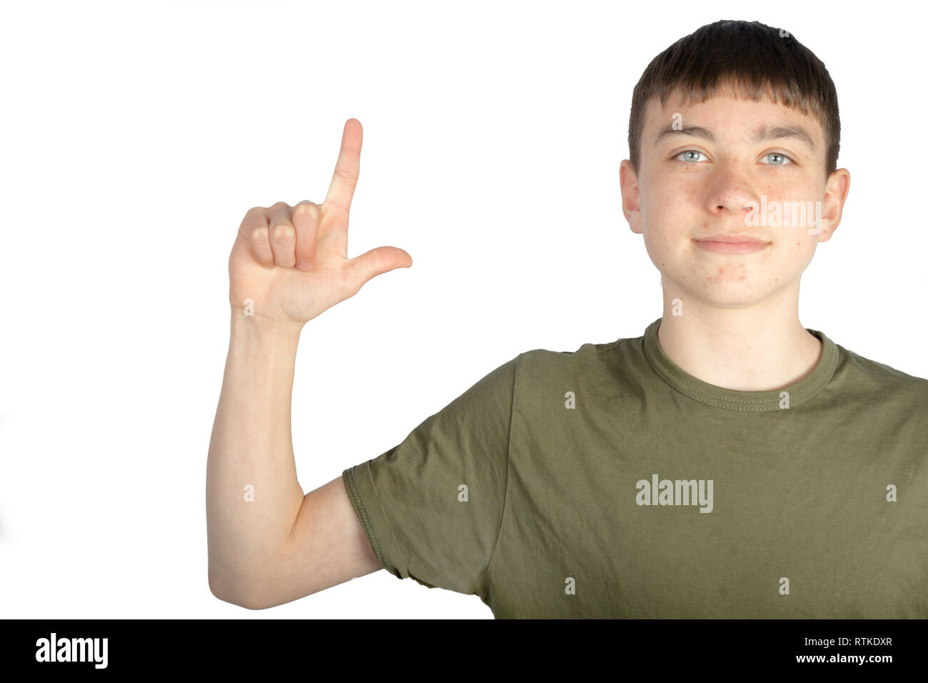 Caucasian teenage boy doing American Sign Language on one hand showing