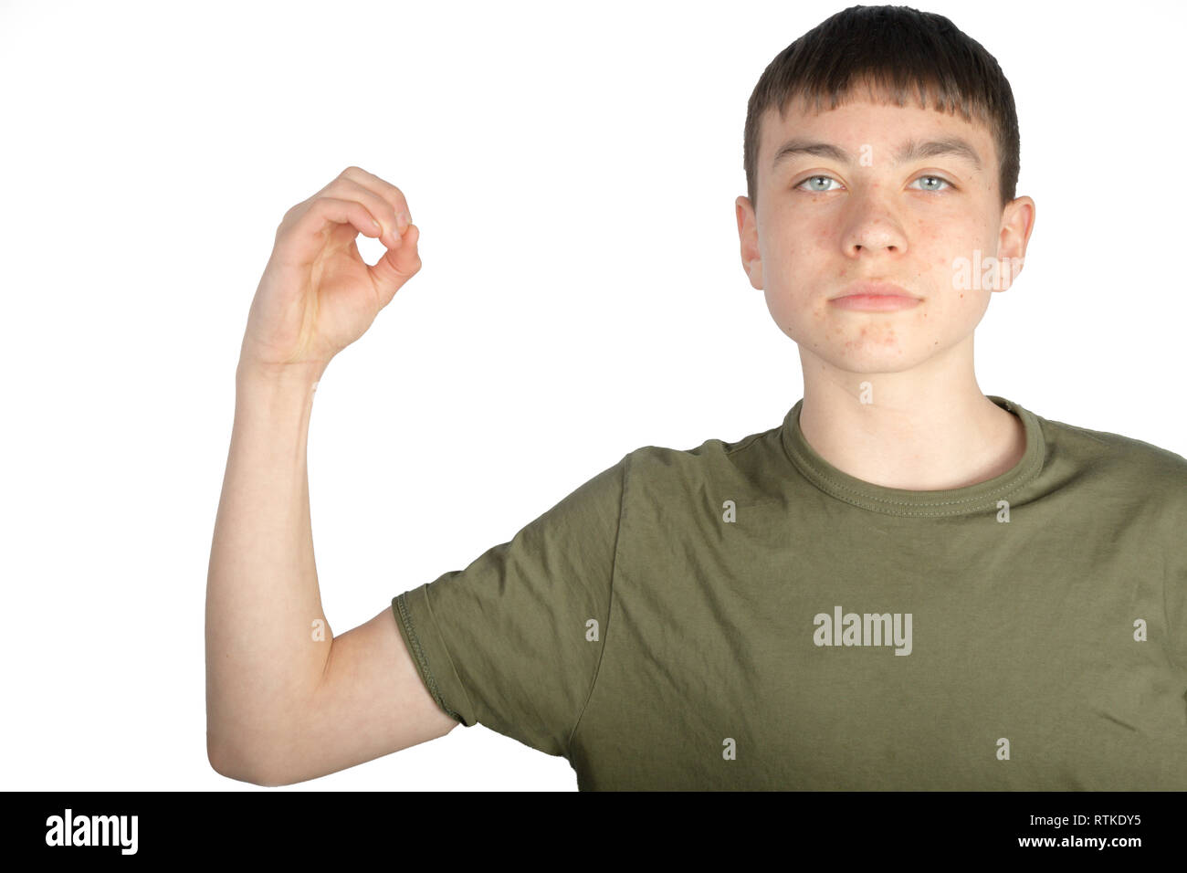 Caucasian teenage boy doing American Sign Language on one hand showing