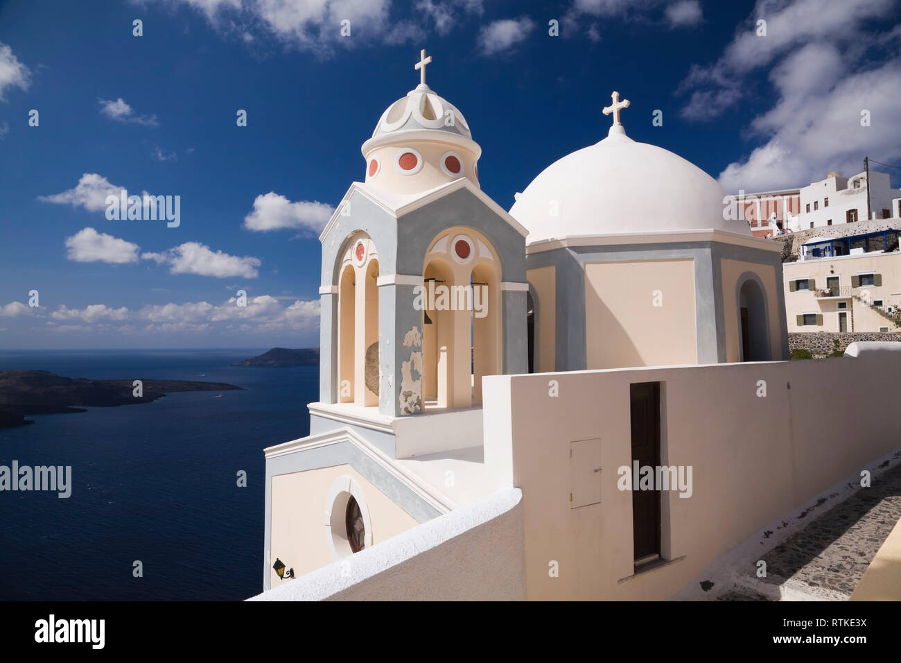 White domed chapel and bell tower, Fira village, Santorini, Greece Stock Photo
