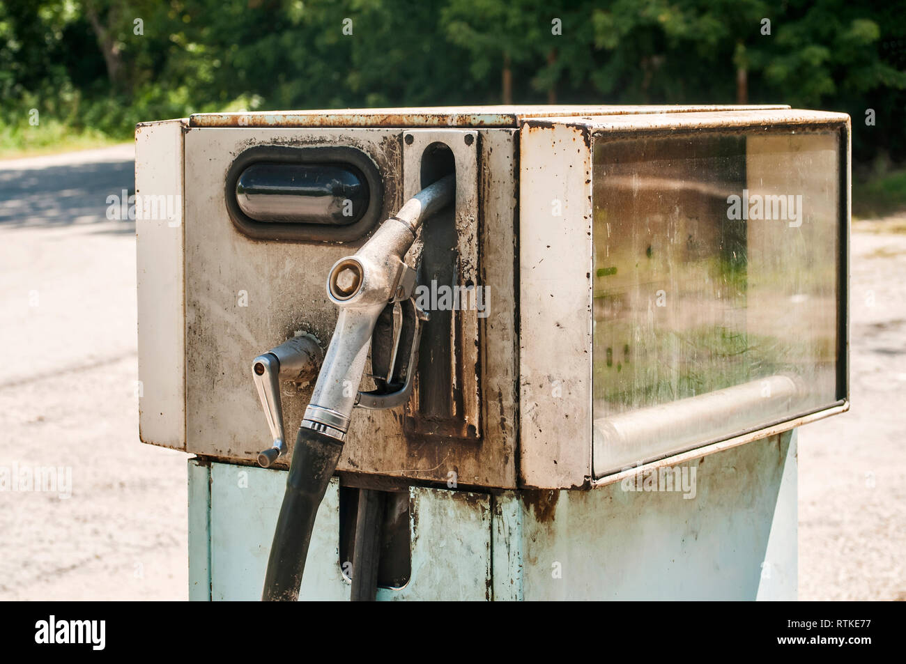 Old abandoned vintage obsolete petrol fuel gas dispenser in former