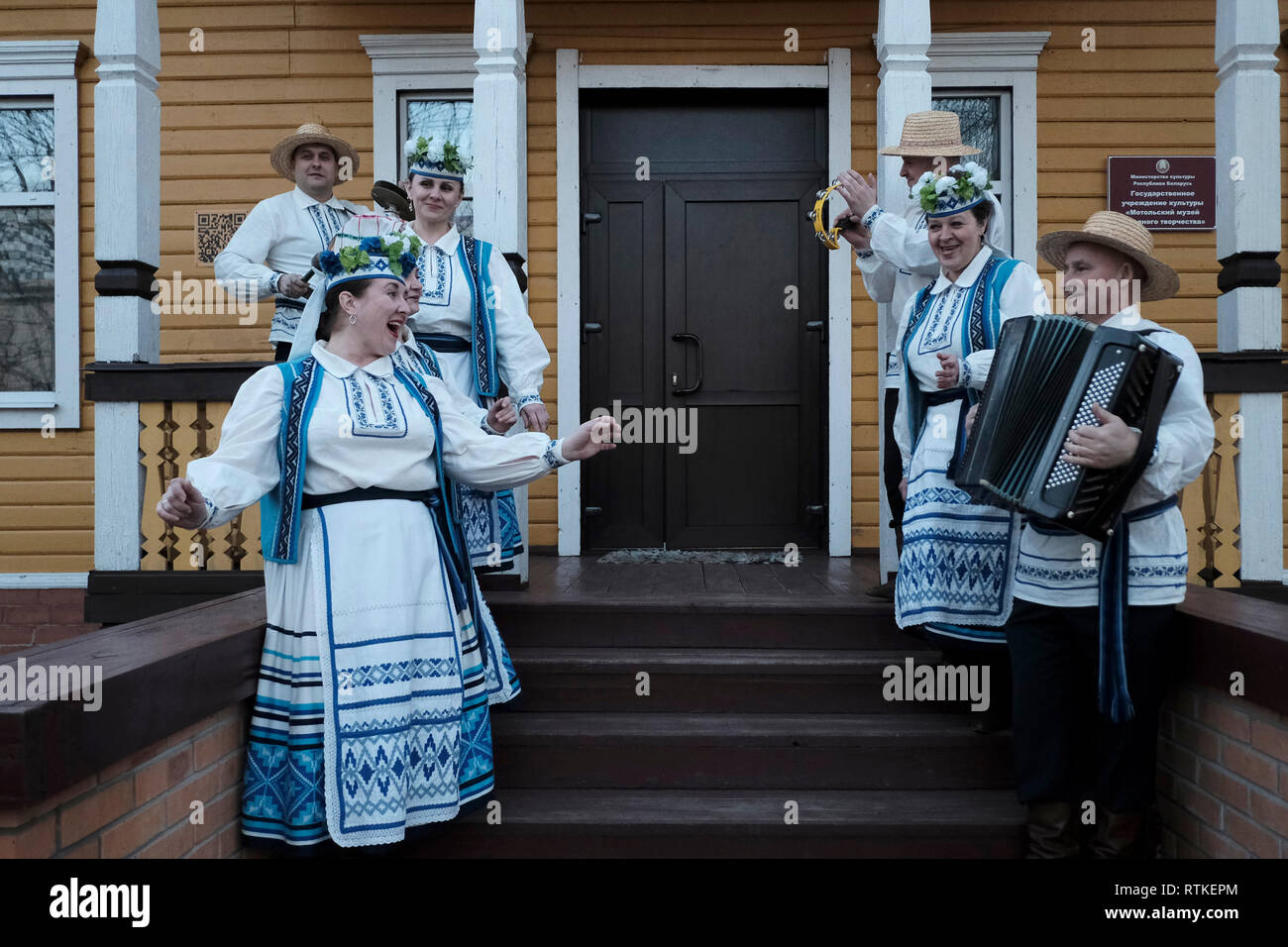 Belarusian folklore band in traditional garment singing folk songs at