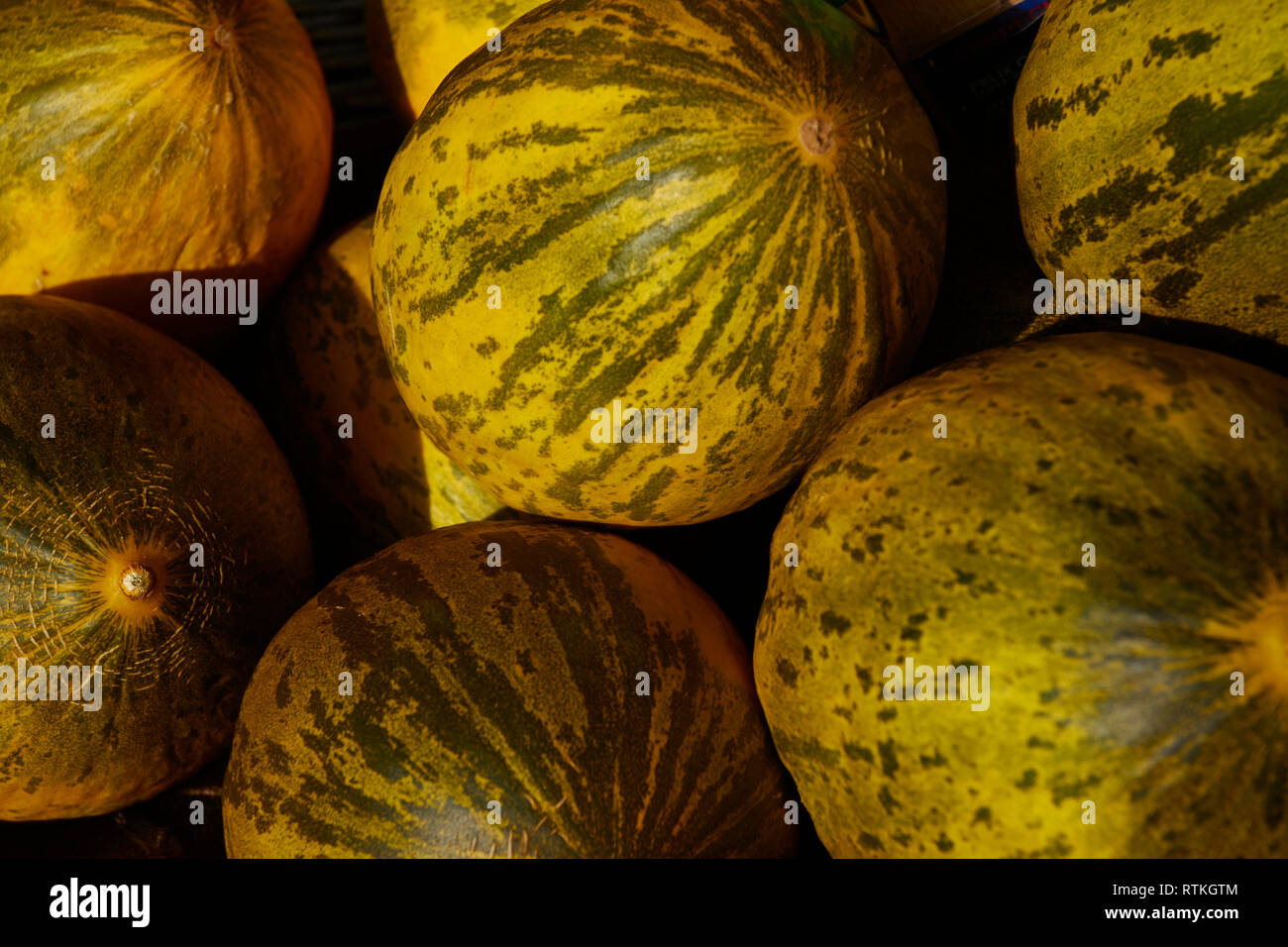 Melons for sale on a market stall in London, England, United Kingdom