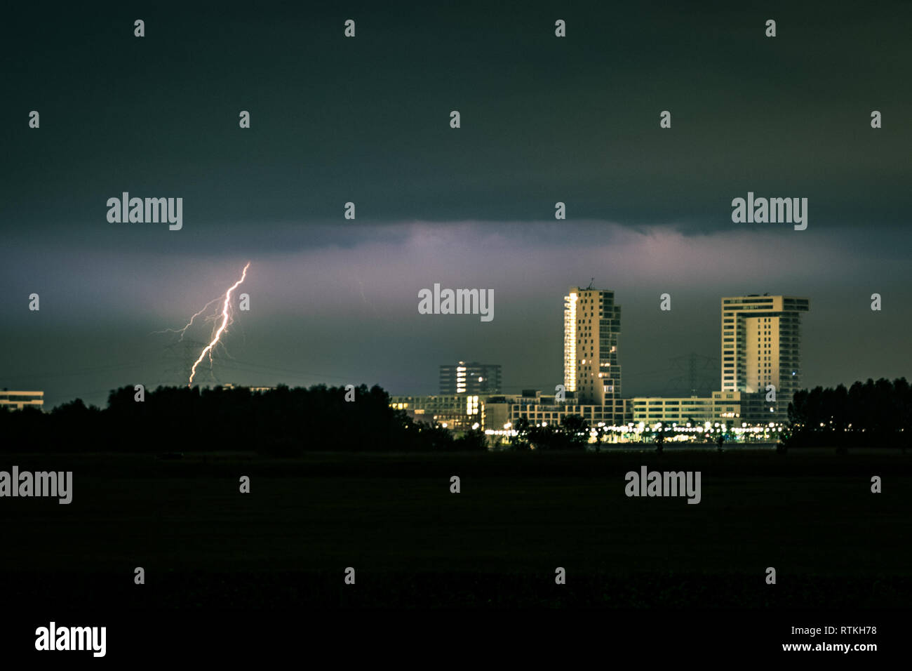 Lightning strike near the skyline of Rotterdam, The Netherlands Stock