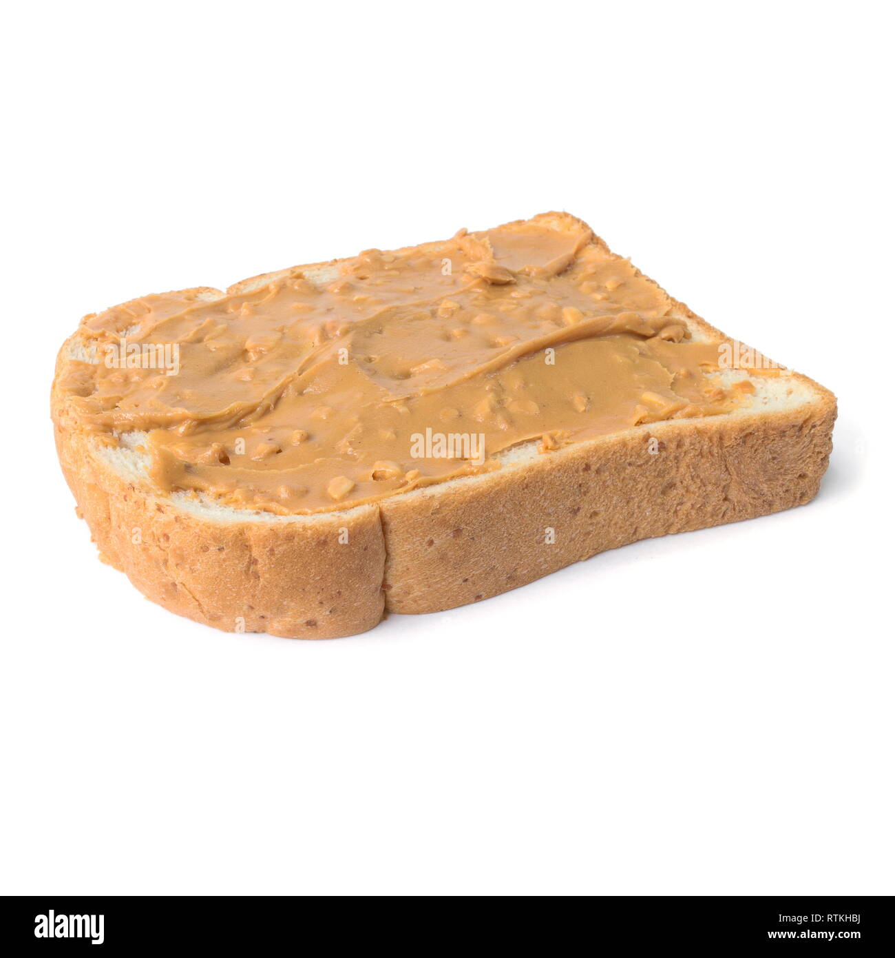 Fresh whole wheat bread slice with chunky peanut butter isolated on a