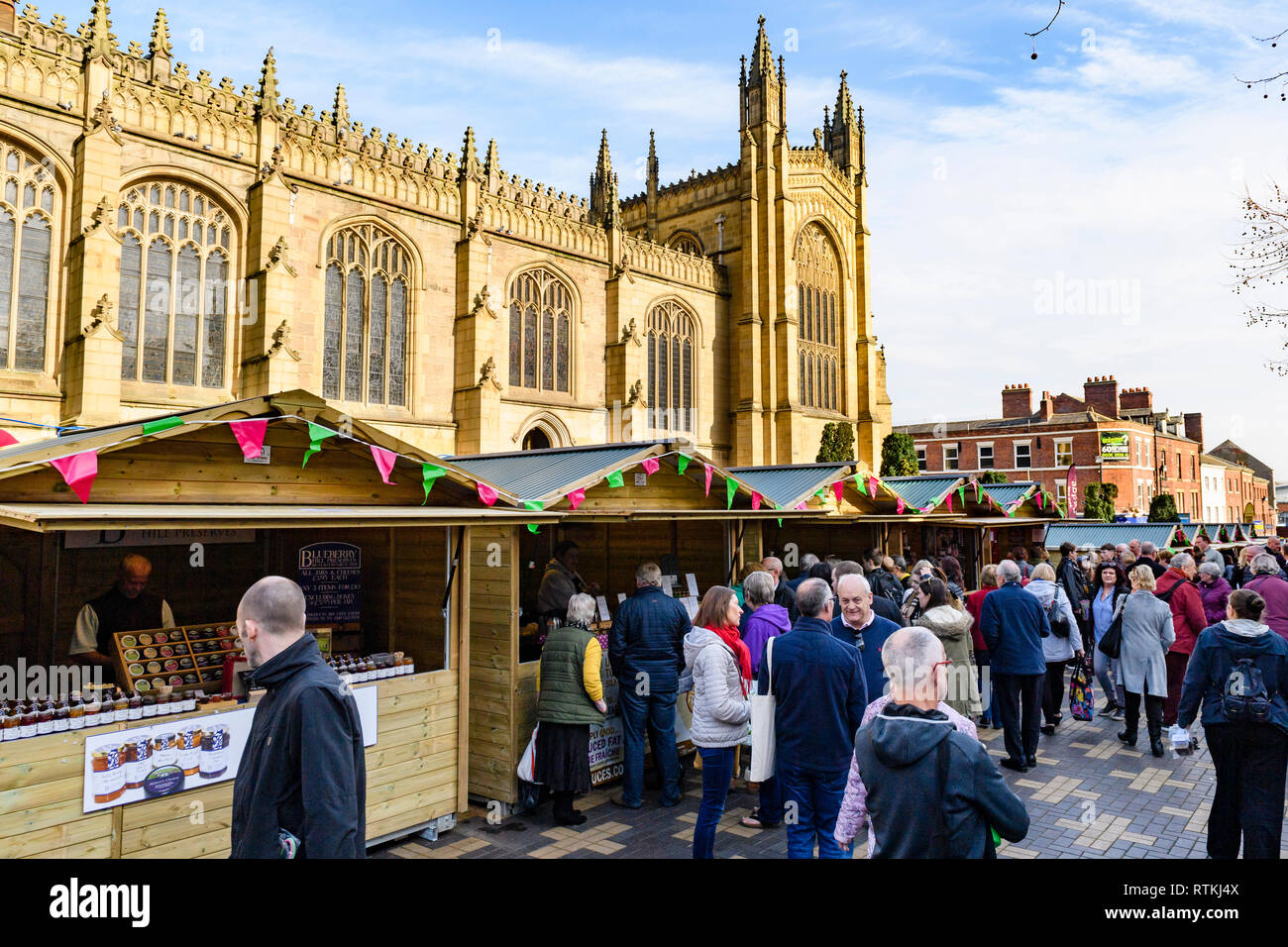 People shopping at busy Wakefield Food, Drink & Rhubarb Festival 2019, visiting market trade stalls & cathedral precinct - West Yorkshire, England, UK Stock Photo