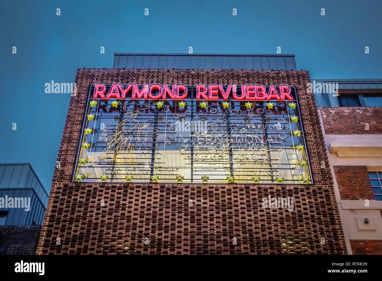 Illuminated neon sign outside the former Raymond Revue bar on Brewer Street, Soho, Central London, England, U.K. Stock Photo