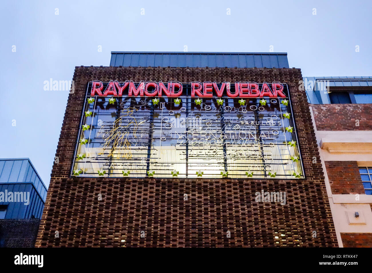 Illuminated neon sign outside the former Raymond Revue bar on Brewer Street, Soho, Central London, England, U.K. Stock Photo